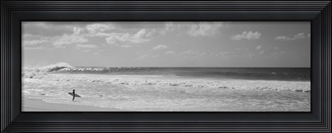 Framed Surfer standing on the beach in black and white, Oahu, Hawaii Print