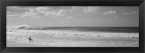 Framed Surfer standing on the beach in black and white, Oahu, Hawaii Print