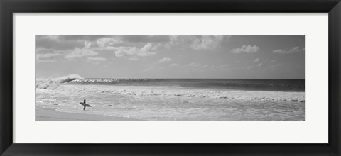 Framed Surfer standing on the beach in black and white, Oahu, Hawaii Print