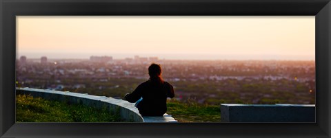 Framed Man sting on the ledge in Baldwin Hills Scenic Overlook Park, Culver City, Los Angeles County, California, USA Print