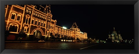 Framed Facade of a building lit up at night, GUM, Red Square, Moscow, Russia Print