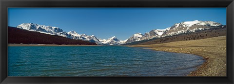 Framed Lake with snow covered mountains in the background, Sherburne Lake, US Glacier National Park, Montana, USA Print