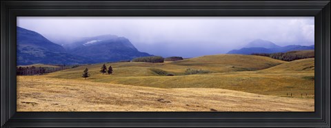Framed Rolling landscape with mountains in the background, East Glacier Park, Glacier County, Montana, USA Print