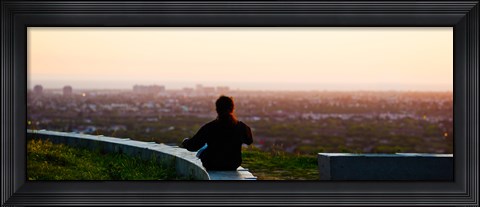 Framed Man sting on the ledge in Baldwin Hills Scenic Overlook Park, Culver City, Los Angeles County, California, USA Print