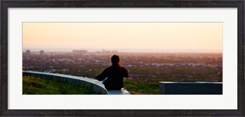 Framed Man sting on the ledge in Baldwin Hills Scenic Overlook Park, Culver City, Los Angeles County, California, USA Print