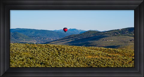 Framed Hot air balloon flying in a valley, Park City, Utah, USA Print