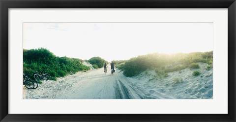 Framed Rear view of a couple cycling along a beach trail, Fort Tilden, Queens, New York City, New York State, USA Print