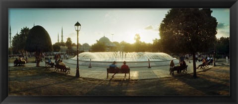 Framed People sitting at a fountain with Blue Mosque in the background, Istanbul, Turkey Print