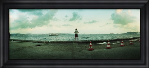 Framed Boy looking out on the Bosphorus Strait, Istanbul, Turkey Print