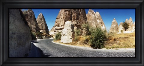 Framed Winding road passing through rocks, Cappadocia, Central Anatolia Region, Turkey Print