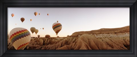 Framed Hot air balloons crossing a plateau, Cappadocia, Central Anatolia Region, Turkey Print