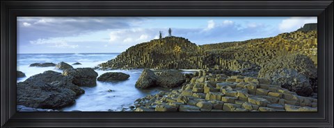 Framed People climbing on rocks at Giant's Causeway, Bushmills, County Antrim, Northern Ireland Print