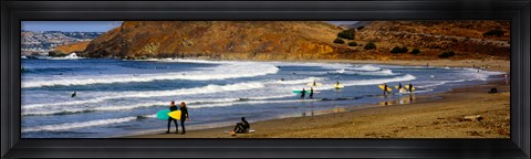 Framed Surfers on the beach, California, USA Print