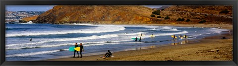 Framed Surfers on the beach, California, USA Print