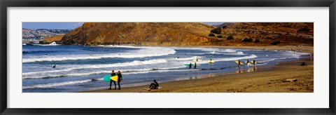 Framed Surfers on the beach, California, USA Print