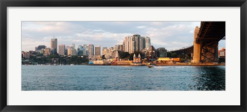 Framed Skyscrapers at the waterfront, McMahons Point, Sydney Harbor Bridge, Sydney Harbor, Sydney, New South Wales, Australia 2012 Print