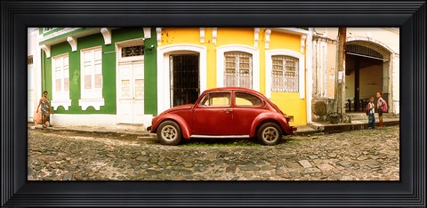 Framed Small old red car parked in front of colorful building, Pelourinho, Salvador, Bahia, Brazil Print