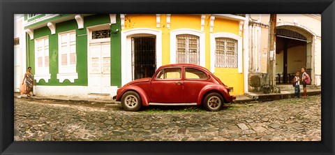 Framed Small old red car parked in front of colorful building, Pelourinho, Salvador, Bahia, Brazil Print