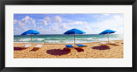 Framed Lounge chairs and beach umbrellas on the beach, Fort Lauderdale Beach, Florida, USA Print