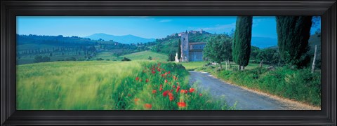 Framed Road passing through field Print