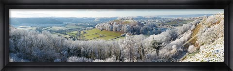 Framed Snow covered trees in a valley from Uley Bury, Downham Hill, Gloucestershire, England Print