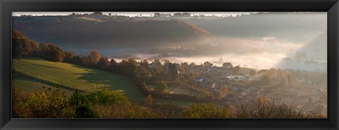 Framed Misty morning valley with village, Uley, Gloucestershire, England Print