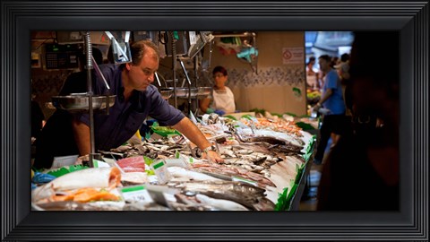 Framed Fishmonger at a fish stall, La Boqueria Market, Ciutat Vella, Barcelona, Catalonia, Spain Print