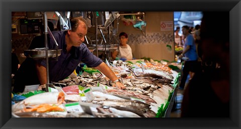 Framed Fishmonger at a fish stall, La Boqueria Market, Ciutat Vella, Barcelona, Catalonia, Spain Print