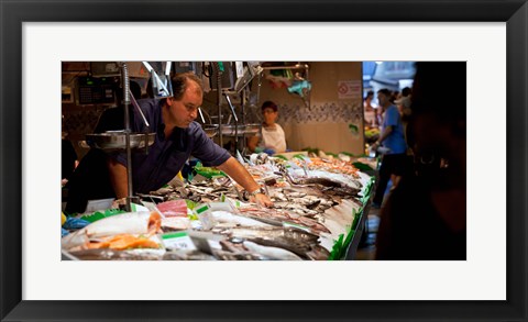 Framed Fishmonger at a fish stall, La Boqueria Market, Ciutat Vella, Barcelona, Catalonia, Spain Print