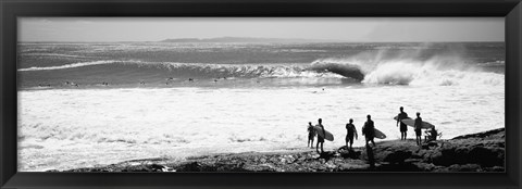 Framed Silhouette of surfers standing on the beach, Australia (black and white) Print