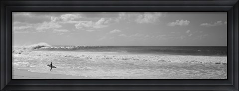 Framed Surfer standing on the beach in black and white, Oahu, Hawaii Print