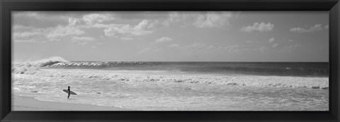 Framed Surfer standing on the beach in black and white, Oahu, Hawaii Print