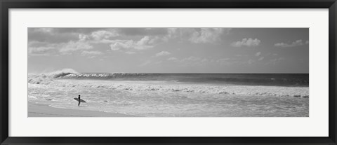 Framed Surfer standing on the beach in black and white, Oahu, Hawaii Print