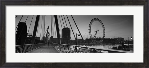 Framed Bridge across a river with a ferris wheel, Golden Jubilee Bridge, Thames River, Millennium Wheel, London, England Print