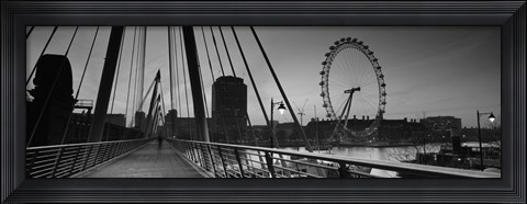 Framed Bridge across a river with a ferris wheel, Golden Jubilee Bridge, Thames River, Millennium Wheel, London, England Print