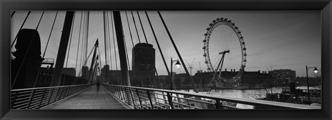 Framed Bridge across a river with a ferris wheel, Golden Jubilee Bridge, Thames River, Millennium Wheel, London, England Print