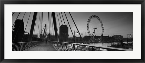 Framed Bridge across a river with a ferris wheel, Golden Jubilee Bridge, Thames River, Millennium Wheel, London, England Print