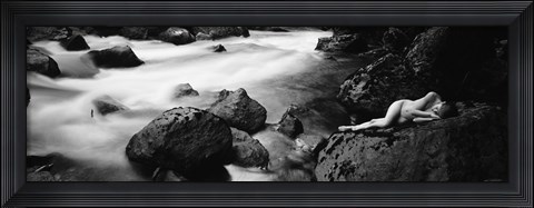 Framed Side profile of a naked woman lying on a rock Print