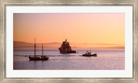 Framed Tugboat with a trawler and a tall ship in the Baie de Douarnenez at sunrise, Finistere, Brittany, France Print
