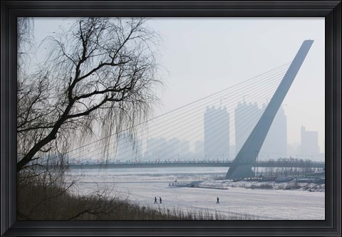 Framed Songhuajiang Highway Bridge over the frozen Songhua River with buildings in the background, Harbin, Heilungkiang Province, China Print