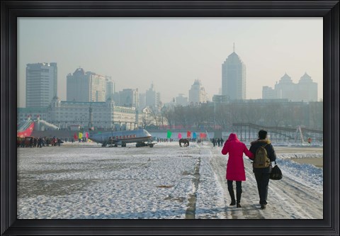 Framed Couple walking on a frozen river, Songhua River, Harbin, Heilungkiang Province, China Print