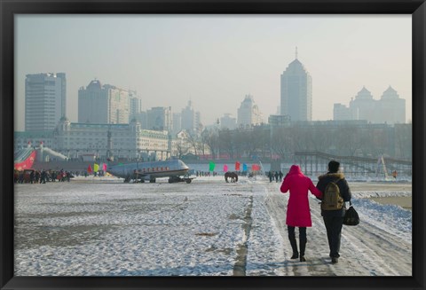 Framed Couple walking on a frozen river, Songhua River, Harbin, Heilungkiang Province, China Print