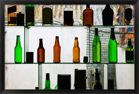 Framed Bottles displayed at foreigner bar, Old Town, Dali, Yunnan Province, China Print