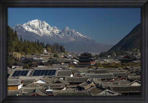 Framed High angle view of houses with Jade Dragon Snow Mountain in the background, Old Town, Lijiang, Yunnan Province, China Print