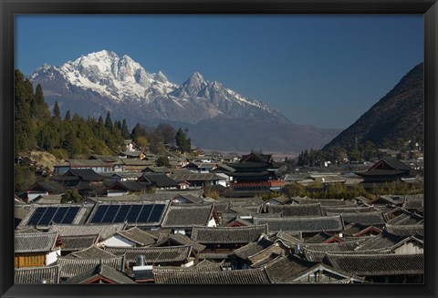 Framed High angle view of houses with Jade Dragon Snow Mountain in the background, Old Town, Lijiang, Yunnan Province, China Print