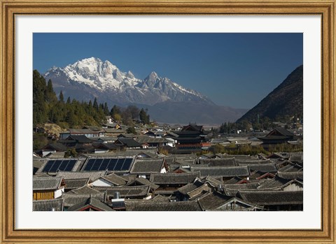 Framed High angle view of houses with Jade Dragon Snow Mountain in the background, Old Town, Lijiang, Yunnan Province, China Print