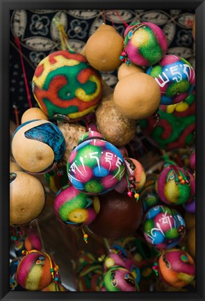 Framed Painted gourds for sale in a street market, Old Town, Lijiang, Yunnan Province, China Print