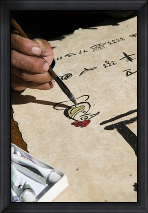 Framed Chinese calligrapher painting calligraphy on a paper at the Dongba Place, Old Town, Lijiang, Yunnan Province, China Print