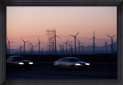 Framed Cars moving on road with wind turbines in background at dusk, Palm Springs, Riverside County, California, USA Print