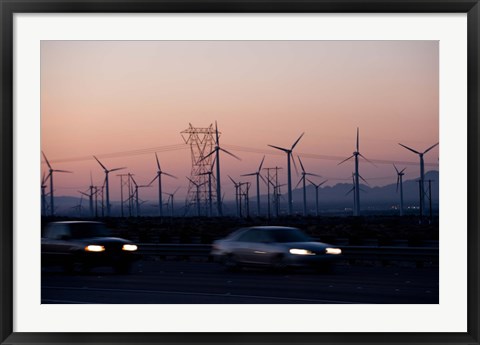 Framed Cars moving on road with wind turbines in background at dusk, Palm Springs, Riverside County, California, USA Print